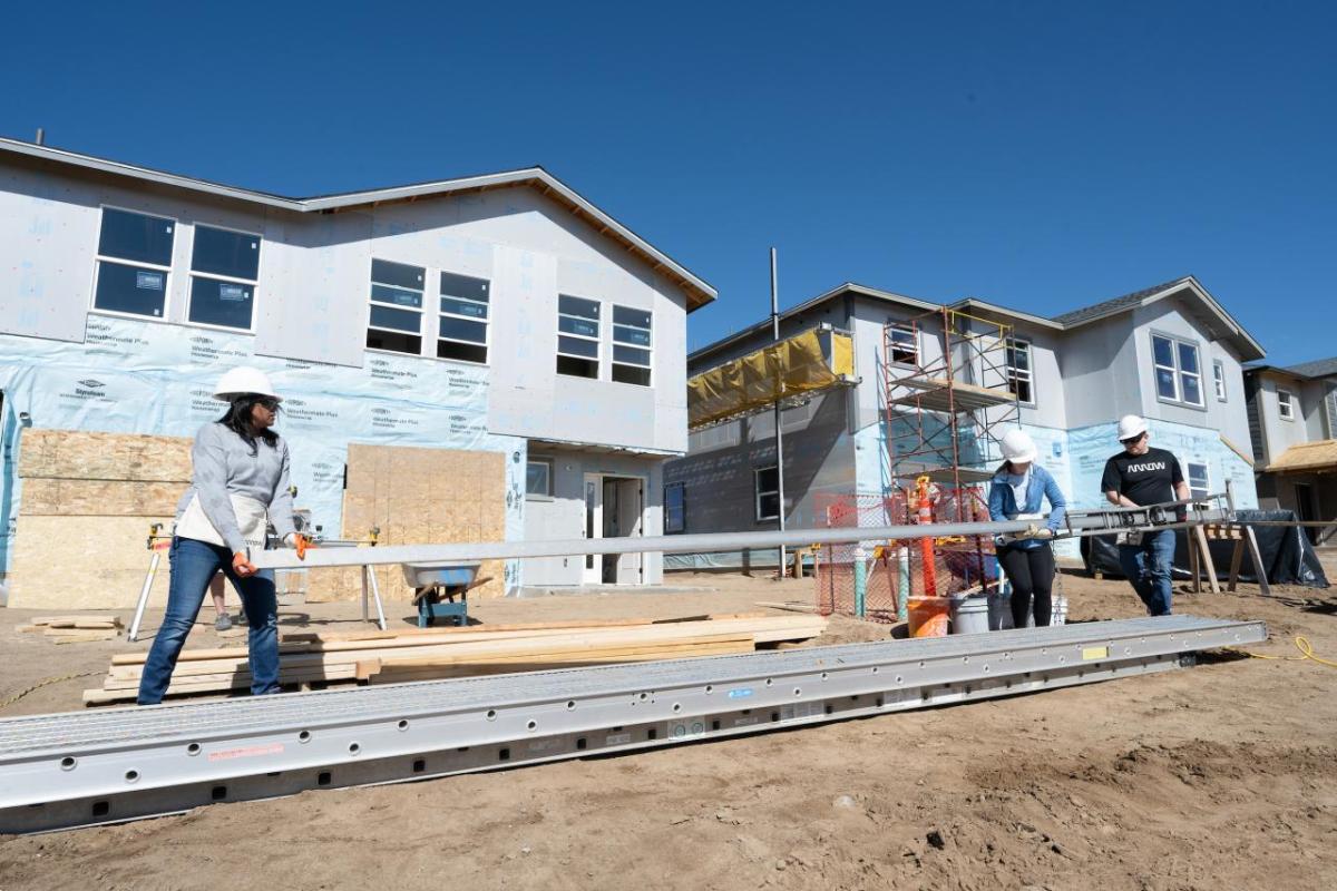 People working on house construction